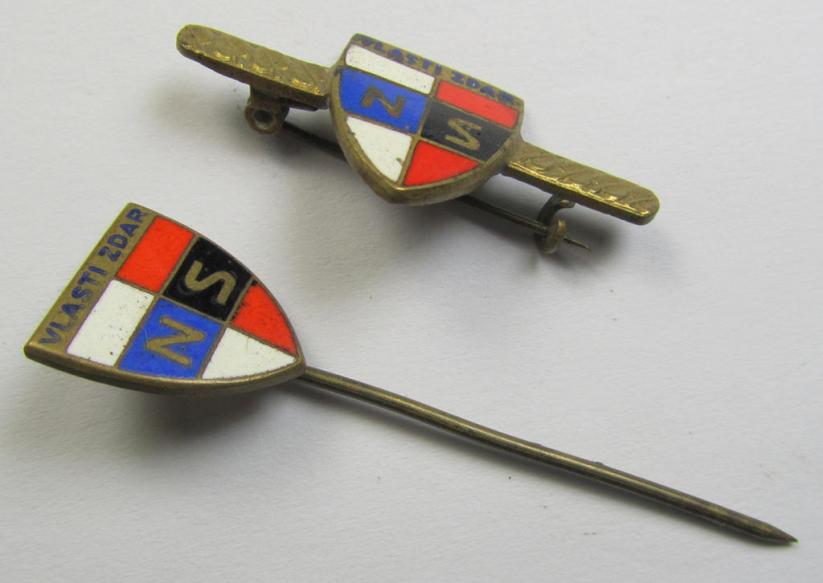 Pair of enamelled Slovakian- ie. Axis party-insignia as both intended for the WWII-period, Slowakian facist-party called: 'Nàrodni Sourucenstvi (NS)' both insignia coming in an overall nice albeit clearly used- ie. worn condition