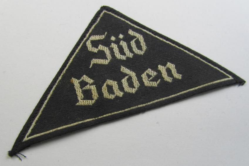 'HJ' ('Hitlerjugend') ie. 'BDM' ('Bund Deutscher Mädel') district-triangle (ie. 'Gebietsdreieck') being an example that still shows its period-attached 'RzM-etiket' entitled: 'Süd Baden'