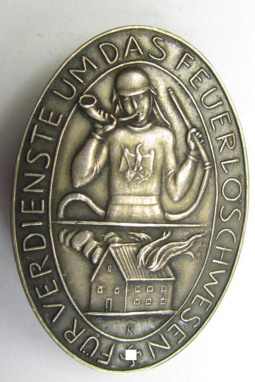 Pre-war-period- and/or genuine silver-based (ie. '900'-stamped), so-called: 'Erinnerungszeichen Verdienste um das Feuerlöschwesen 1934', being a very detailed- and maker- (ie. 'Preuss. Staatsmünze'-) marked, example
