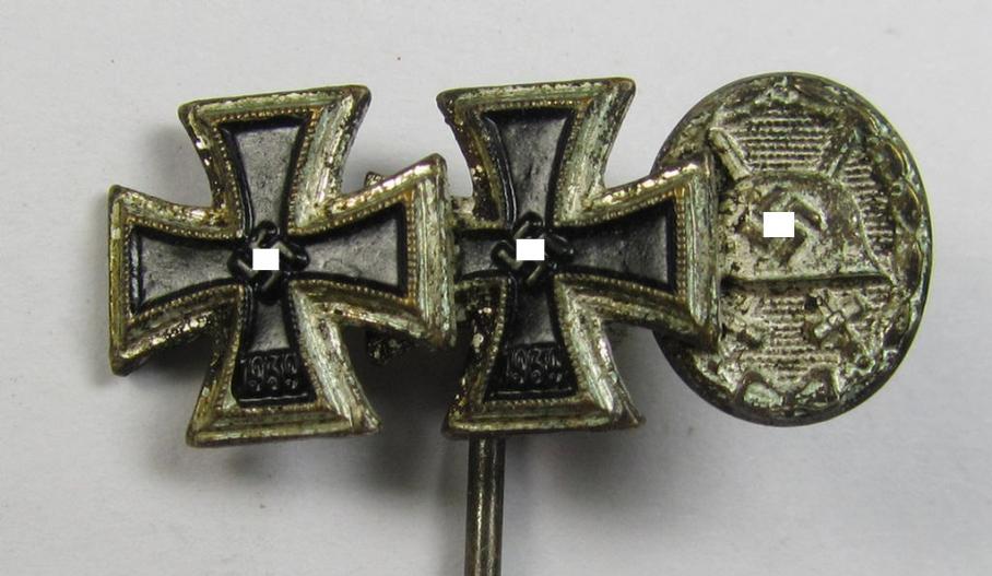 Detailed, 9-mm.-sized medal-lapel-pin, being a maker- (ie. 'L/16'-) marked example depicting respectively: an 'EK I. Klasse', an: 'EK II. Klasse' and a: 'Verwundeten-Abzeichen in Silber'