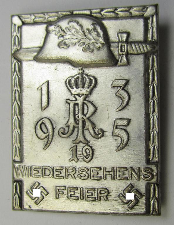 Commemorative, silver-toned-, WH (Heeres) related 'tinnie', being a non-maker-marked example, depicting a steel-helmet and sword-device with under that the text: '1935 - IR 19 - Wiedersehensfeier'