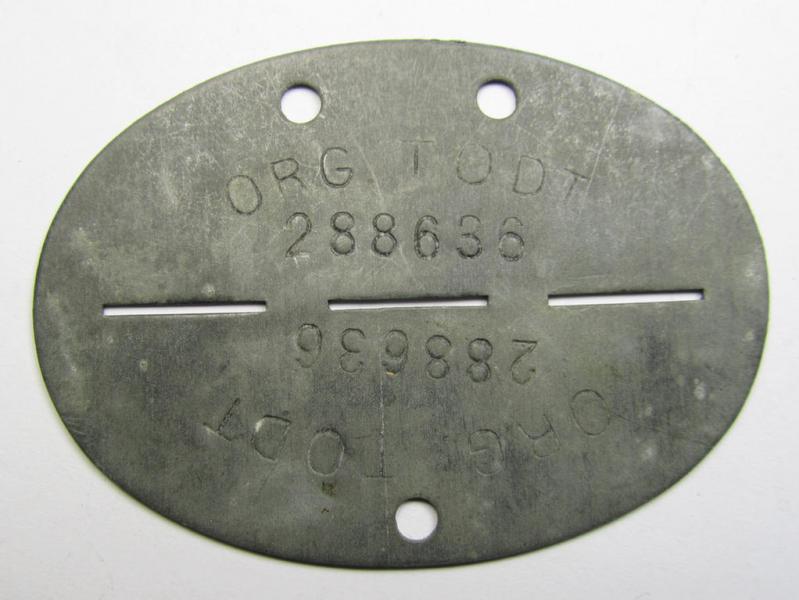 Zinc-based, 'Organisation Todt'-related ID-disc (ie. 'Erkennungsmarke') bearing the clearly stamped designation that reads: 'Org. Todt - 288636'
