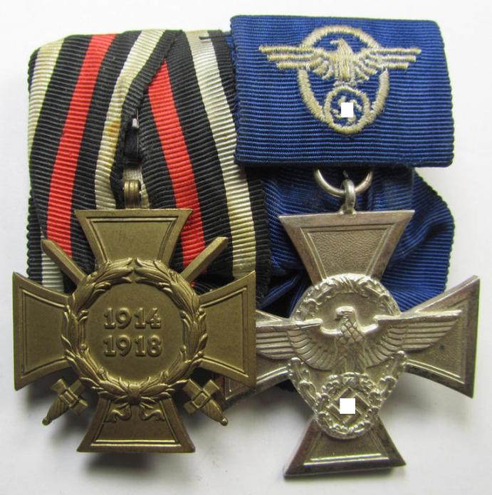 Two-pieced medal-bar (ie. 'Doppelspange') respectively depicting a WWI-period: 'Frontkämpferkreuz 1914-18' (ie.: 'Kriegsteilnehmerkreuz mit Schwerter') and a detailed: 'Polizei-Dienstauszeichnung 2. Stufe'