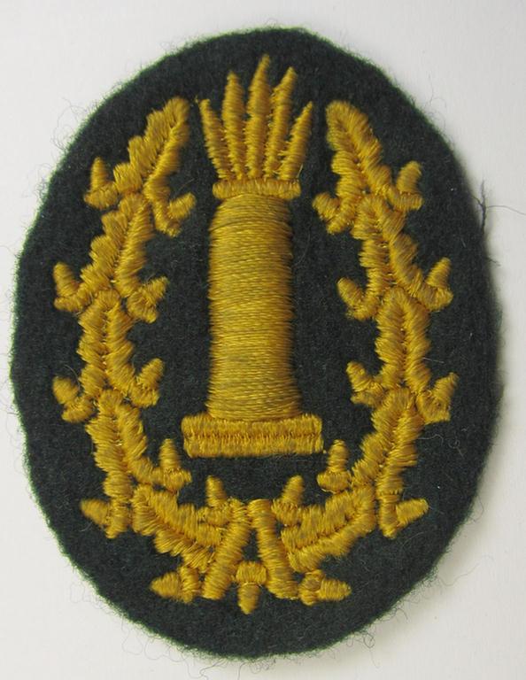 Machine-embroidered, WH (Heeres) so-called: 'Richtabzeichen für Artillerie-Richtkannoniere' (or: artillery gun-layers patch) being a detailed example that comes in a clearly used- ie. worn- and carefully tunic-removed-, condition