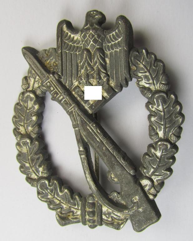 Superb, 'hollow-back' 'Infanterie Sturmabzeichen in Silber' (or: silver infantry-assault badge ie. IAB) being a non-maker-marked example as executed in zinc-based metal (ie. 'Feinzink') as was produced by the: 'Wilh. Deumer'-company