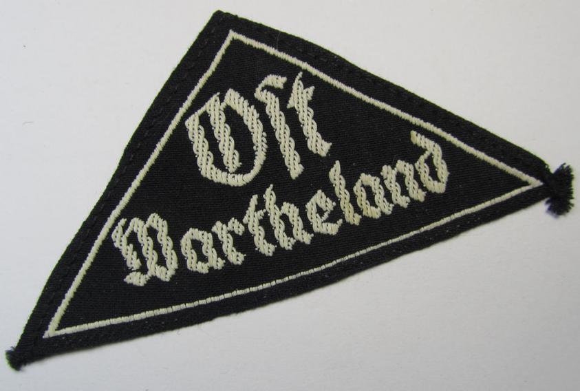 Stunning - and extremely rarely encountered! - HJ ('Hitlerjugend') ie. BDM (or: 'Bund Deutscher Mädel') district-triangle (ie. 'Gebietsdreieck') entitled: 'Ost Wartheland'