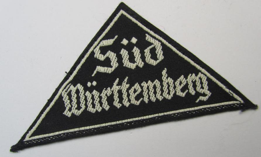 Attractive, 'HJ' ('Hitlerjugend') ie. 'BDM' ('Bund Deutscher Mädel'-) district-triangle (ie. 'Gebietsdreieck') entitled: 'Süd Württemberg' (being a never worn example that still retains its period-attached 'RzM'-etiket)