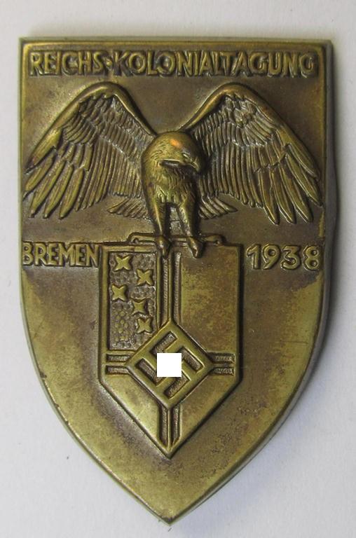 Commemorative, copper-based- (ie. 'NS-Reichskolonial-Bund'-related-) 'tinnie', being a non-maker-marked example depicting an 'eagle'-device above the 'NS-Reichskolonial-Bund'-device and showing the text: 'Reichskolonialtagung - Bremen - 1938'