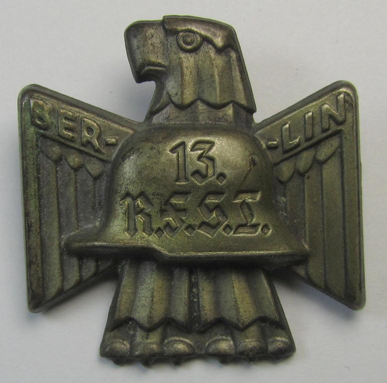 Detailed, silverish-toned WWI-veteran-related day-badge (ie. 'tinnie' or: 'Veranstaltungsabzeichen') as was issued to commemorate a veteran-related meeting entitled: 'R.F.S.T. - Berlin - 1932'