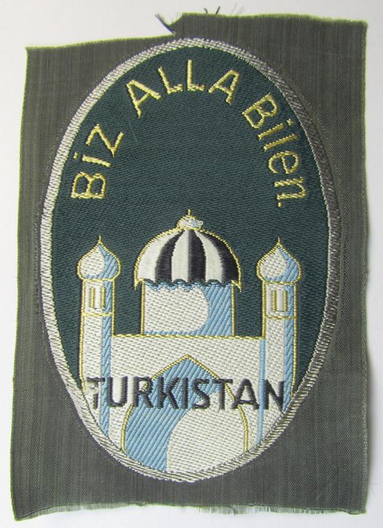 Superb, 'BeVo'-type armshield (of the rarely encountered first pattern!) entitled: 'Biz Alla Bilen - Turkistan' (being a piece that was intended for a volunteer who served within the: 'Deutsche Wehrmacht' ie. within the: 'Turkistanisches Legion')