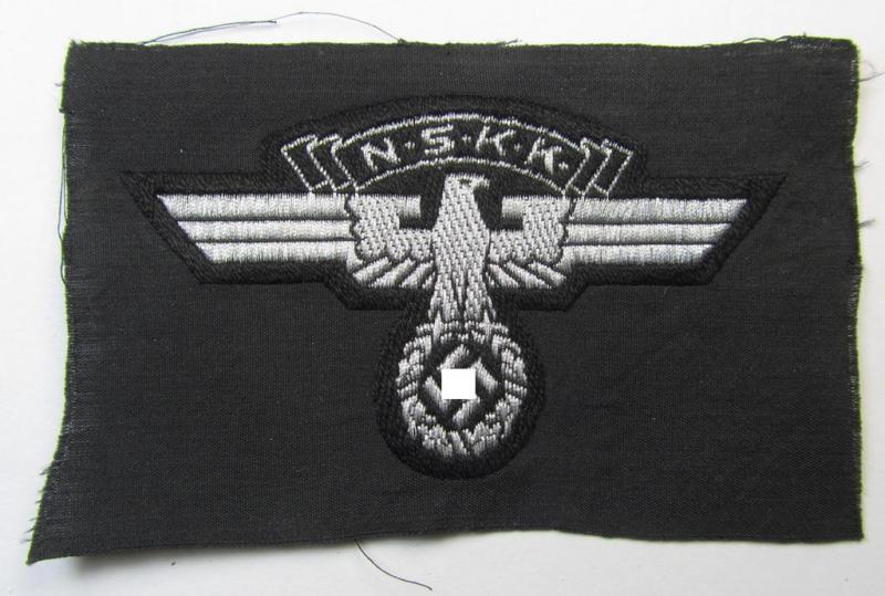 Attractive and typically 'BeVo flat-wire'-woven, so-called: N.S.K.K. (ie. 'National Socialistisches Kraftfahr Korps') arm-eagle being a very detailed- and/or 'virtually mint' example that still retains its period-attached 'RzM'-etiket