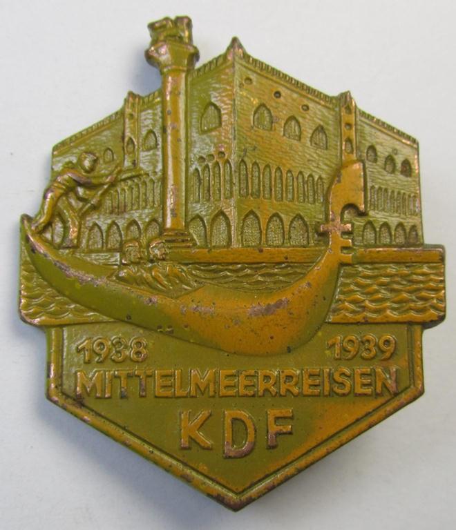 Attractive, so-called: 'KdF'- ('DAF-/Kraft durch Freude'-) related day-badge (ie. 'tinnie') as was issued to commemorate the Mediterranean-trips and depicting a scene in Venice and text: 'Mittelmeerreisen - KdF - 1938-1939'