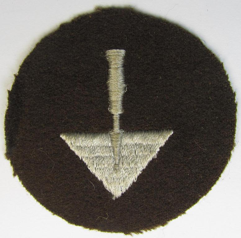 Presumably OT- (ie. 'Organisation Todt'-) related trade- ie. special-career-patch as was specifically intended for a: 'Zimmermann o. Maurer' and that comes in a 'virtually mint' and/or never tunic-attached, condition