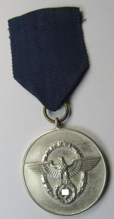 Moderately worn, bright-silver-toned, so-called: 'Polizei-Dienstauszeichnung 3. Stufe' (or: police loyal-service medal third-class) that comes mounted onto its period ribbon (ie. 'Bandabschnitt')