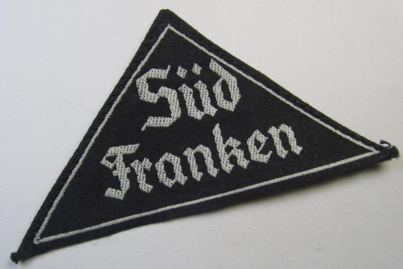 Attractive, 'HJ' ('Hitlerjugend') ie. 'BDM' ('Bund Deutscher Mädel'-) district-triangle (ie. 'Gebietsdreieck') entitled: 'Süd Franken' (being I deem a never worn example that misses its 'RzM'-etiket)