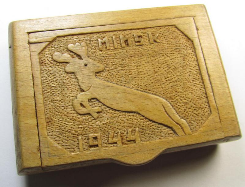 Interesting, later-war-period WH (Luftwaffe-, Heeres etc.-) related, hand-carved and wooden-based  'souvenir'- (ie. cigarette?) box depicting a jumping elk and showing the engraved text: 'Minsk - 1944'