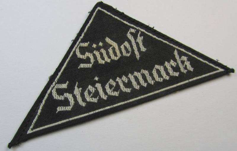 'HJ' ('Hitlerjugend') ie. 'BDM' ('Bund Deutscher Mädel'-) district-triangle (ie. 'Gebietsdreieck') entitled: 'Südost Steiermark' (being a 'virtually mint- ie. unissued' example that still retains its paper-based 'RzM'-etiket)
