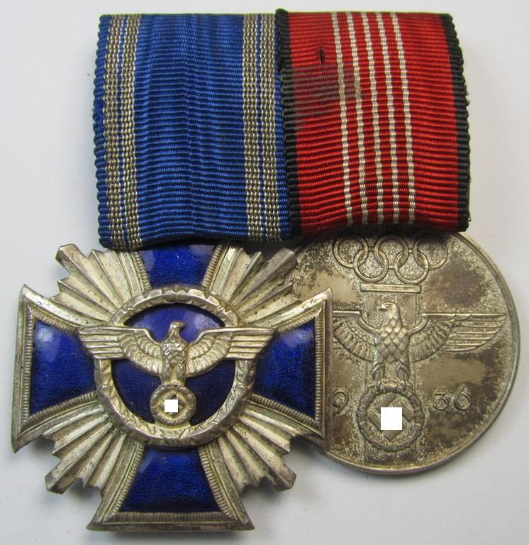 Superb, two-pieced medal-bar (ie. 'Ordenspange') showing resp. an: 'N.S.D.A.P. D.A. in Silber' (ie. '2. Stufe für 15 Jahre t. D.') and a: 'Deutsche Olympia-Erinnerungsmedaille 1936' that both come mounted as a (detachable!) 'Doppelspange'