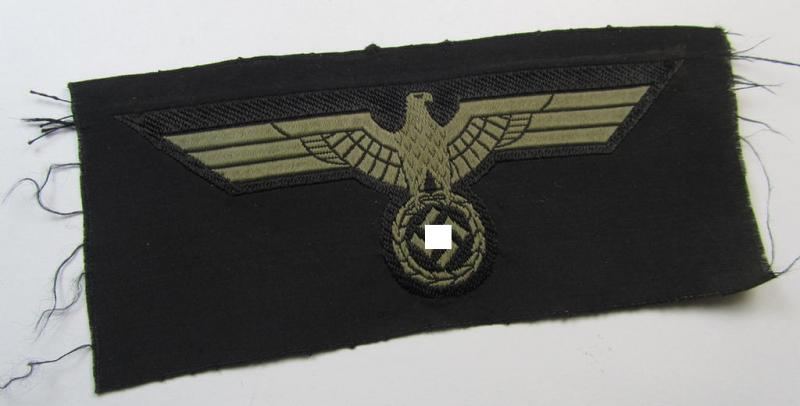 Later- (ie. mid-war-) period, WH (Heeres) 'Panzer'-type breast-eagle (ie. 'Brustadler für Panzertruppen') being a 'virtually mint- ie. unissued' example as executed in bluish-grey-coloured linnen on a black-coloured background