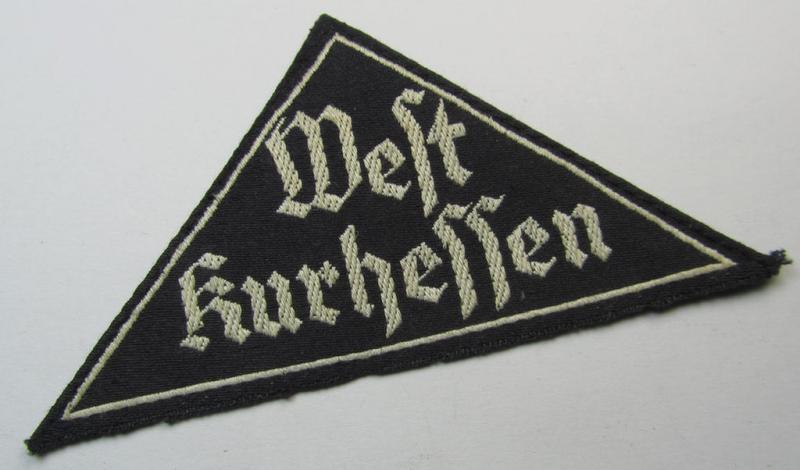 Attractive - and actually rarely seen! - HJ/BDM (ie. 'Hitlerjugend' or: 'Bund Deutsche Mädel') district-triangle (ie. 'Gebietsdreieck') entitled: 'West Kurhessen' (being a 'virtually mint' example that has lost its once present 'RzM-etiket')