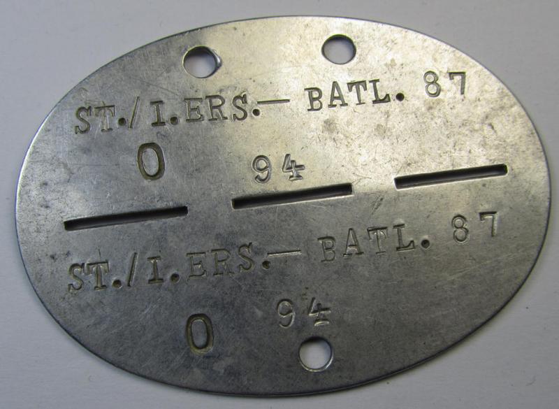 Aluminium-based, WH (Heeres) ie. 'Infanterie'-related ID-disc bearing the clearly stamped unit-designation that simply reads: 'St./I.Ers.- Btl. 87' and that comes as issued- and/or worn