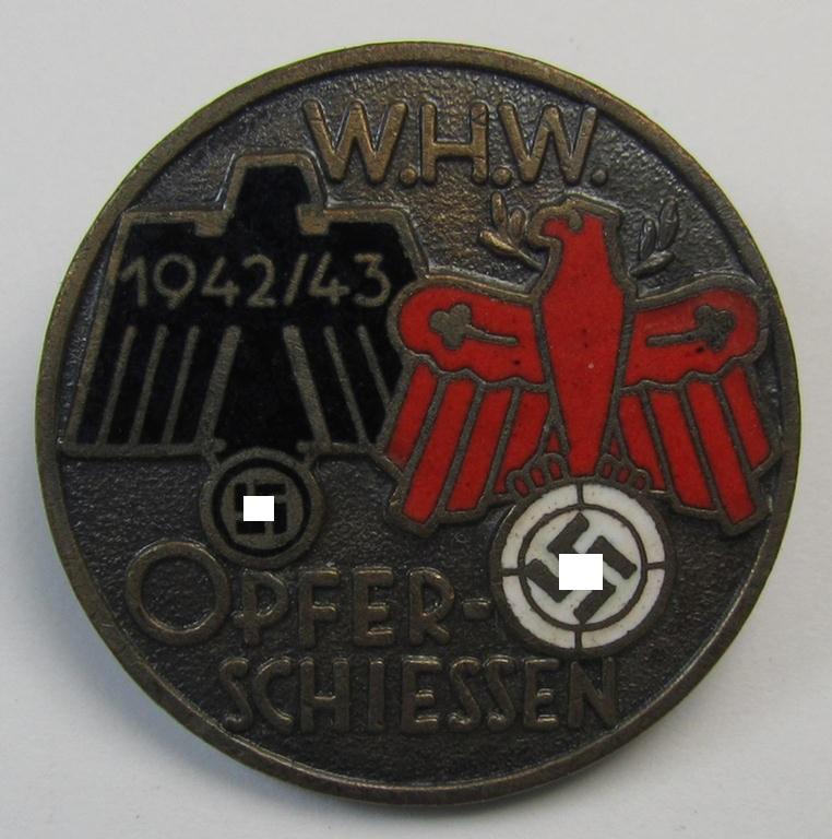 Attractive, WHW- (ie. 'Winterhilfswerke'-) related day-badge (ie. 'tinnie') or: 'Veranstaltungsabzeichen des Standschützenverbandes Tirol-Vorarlberg' depicting the text: 'W.H.W. Opferschiessen 1942/43'