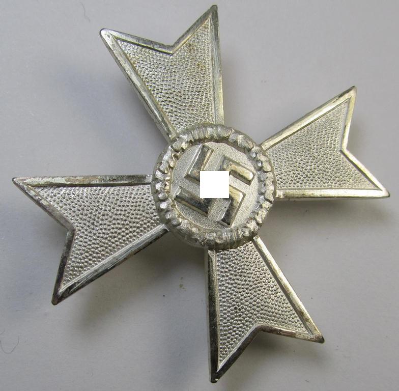 Luxuriously-styled, 'Kriegsverdienstkreuz 1. Klasse ohne Schwertern' being an attractive and maker- (ie. '50'-) marked specimen that is executed in typical, silverish-coloured metal (ie. 'Buntmetall') and that comes in a wonderful condition