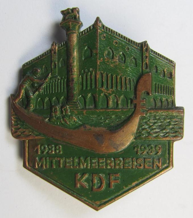 Attractive, so-called: 'KdF'- ('DAF- o. Kraft durch Freude'-) related day-badge (ie. 'tinnie') as was issued to commemorate the Mediterranean-trips and depicting a scene in Venice and text: 'Mittelmeerreisen - KdF - 1938-1939'