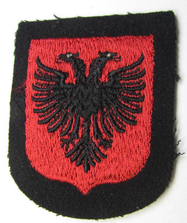 Waffen-SS 'volunteer'-arm-shield as was intended for usage by soldiers of the: '21. Waffen-Grenadier-Division der SS' “Skanderbeg” (ie. 'albanische Nr. 1') and that comes in a 'virtually mint- ie. unissued', condition