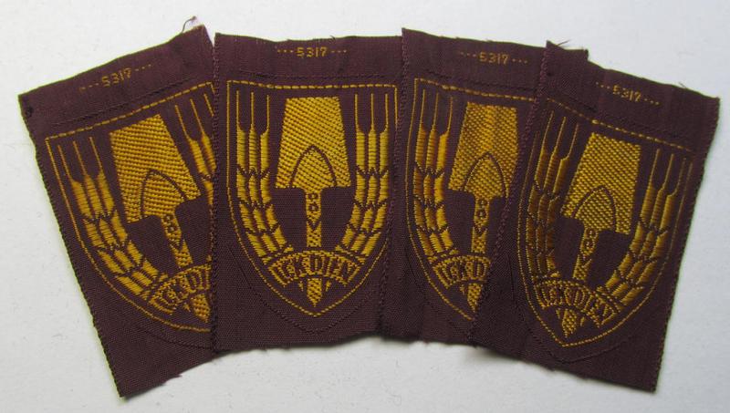 Neat - and nicely 'BeVo-woven'-like - Dutch WWII-period, labour service ie. 'Nederlandse Arbeidsdienst' (or: NAD) cap-badge entitled: 'Ick Dien' and that comes in a 'virtually mint- ie. unissued', condition