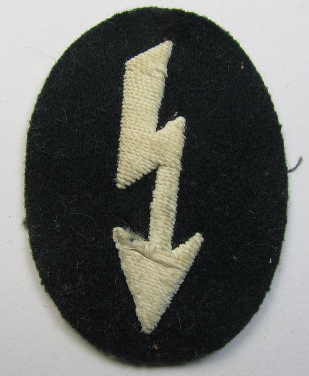 Clearly tunic-removed WH (Heeres) trade- and/or special career insignia ie. hand-embroidered signal-blitz (being a neatly maker-marked example as executed in white) as was intended for a soldier serving within the: 'Infanterie-Truppen'