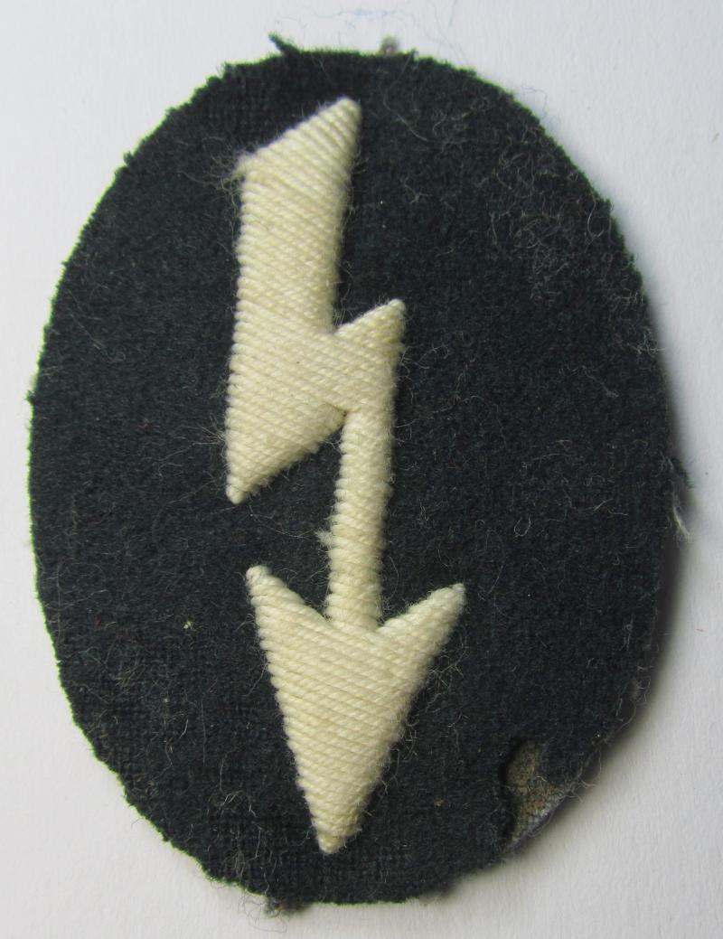 Clearly tunic-removed WH (Heeres) trade- and/or special career insignia ie. hand-embroidered signal-blitz (being a neatly maker-marked example as executed in white) as was intended for a soldier serving within the: 'Infanterie-Truppen'