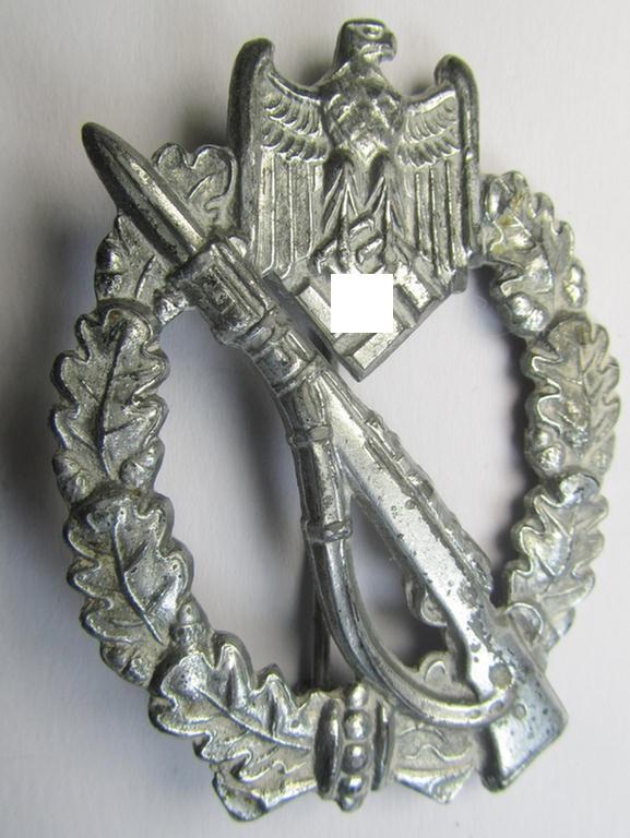 Attractive - and moderately used! - 'Infanterie-Sturmabzeichen in Silber' (or: silver-class infantry-assault badge ie. IAB) being a neatly maker- (ie. 'ÜÜ'- or: 'Hermann Wernstein'-) marked example as executed in silverish-grey-coloured 'Feinzink'