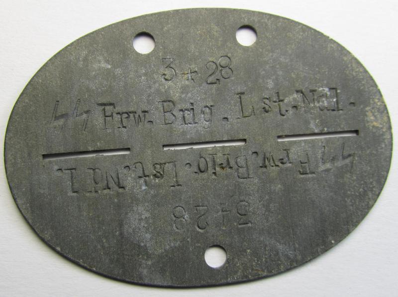 Attractive, zinc-based ID-disc (ie. 'Erkennungsmarke') as was intended for a Dutch Waffen-SS volunteer who served within the 'SS-Brigade Landstorm Nederland' and that is bearing the clearly stamped unit-designation: 'SS Frw.Brig.Lst.Ndl. - 3428'