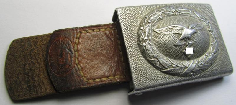 WH (Luftwaffe) 'standard-pattern', aluminium-based belt-buckle (ie. 'Koppelschloss für Uffz. u. Mannschaften der Luftwaffe') being a maker- (ie. 'Dransfeld & Co.'-) marked- and/or '1939'-dated example that comes mounted onto its leather-based tab