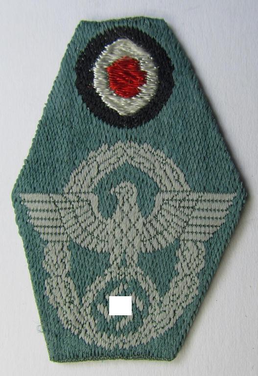Neat, police (ie. 'Polizei') so-called: 'M43-pattern, 'combined cap-eagle- and cocarde-device' as executed in 'BeVo'-weave technique as was specifically intended for usage of the field-grey-coloured: 'Polizei-Einheitsfeldmützen'