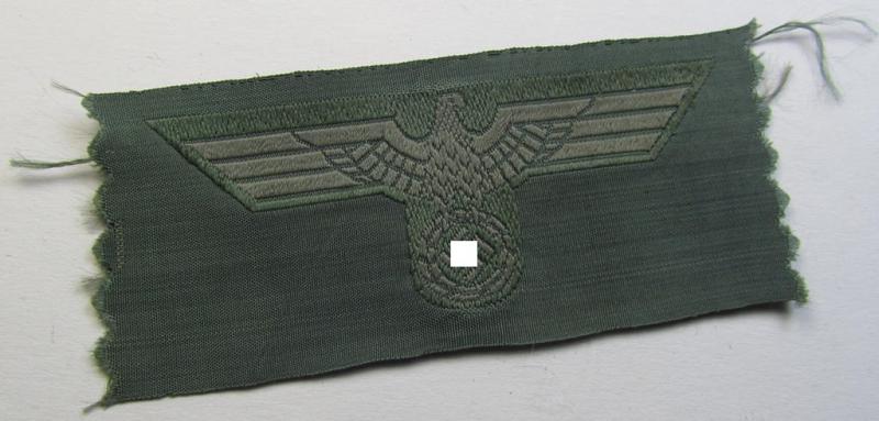 Early- (ie. mid-war-) period, WH (Heeres) cap-eagle (ie. 'Schiffchen-Adler für Mannschaften u. Unteroffiziere') being a virtually mint- ie. unissued example as executed in bluish-grey-coloured linnen on a field-grey-coloured background