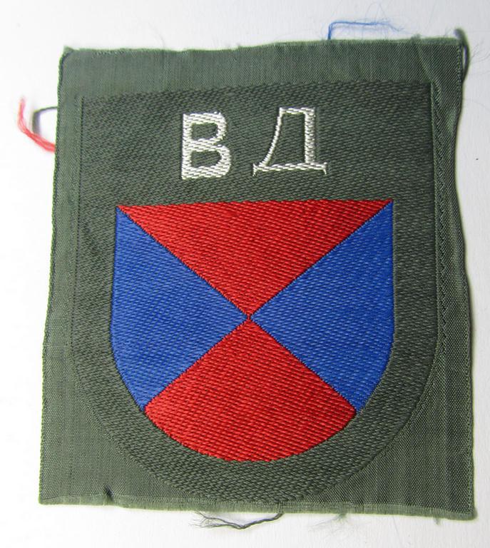 Attractive - and rarely seen! - armshield as executed in the neat 'BeVo'-weave pattern depicting the interwoven 'Cyrillic' characters: 'BA' (as was intended for the Russian volunteers serving within the 'Don Cossacks')