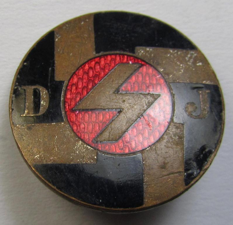 Attractive, multi-coloured- and enamelled membership-lapel-pin as intended to signify membership within the: 'DJ' (or: 'Deutsches Jungvolk in der HJ') being a unusual 'smaller'-sized, non-maker-marked 'variant'-specimen of the 1st pattern