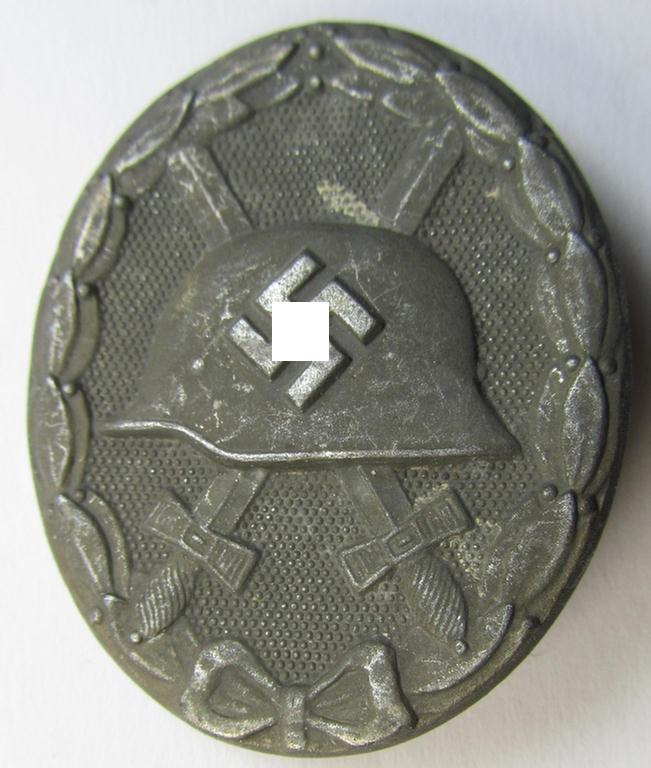 Attractive, maker- (ie. '4'-) marked example of a silver-class wound-badge (or: 'Verwundeten-Abzeichen in Silber') as was produced by the: 'Steinhauer u. Lück'-company