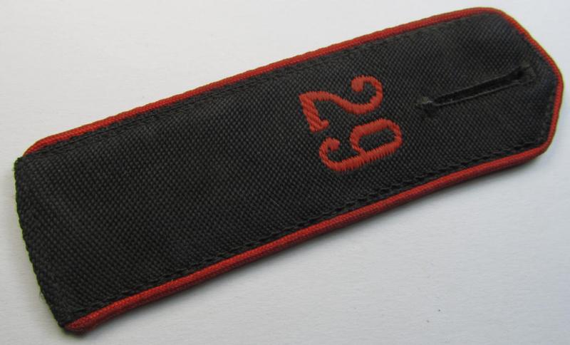 Moderately worn - albeit regrettably single! - bright-red-piped so-called: 'Allgemeine-HJ'-shoulderstrap as was intended for a: 'Hitlerjunge' who served within the 'Bann 29' (29 = 'Bann Bitburg' situated in the 'Gebiet West-Westmark')