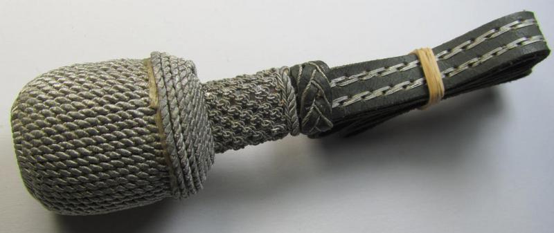 'Standard-issue'-pattern, WH (Heeres) sword-knot (ie. 'Portepee') as executed in green-coloured leather combined with silver-green-coloured 'bullion' and that comes in an overall nice- (ie. I deem just moderately used- ie. worn-), condition