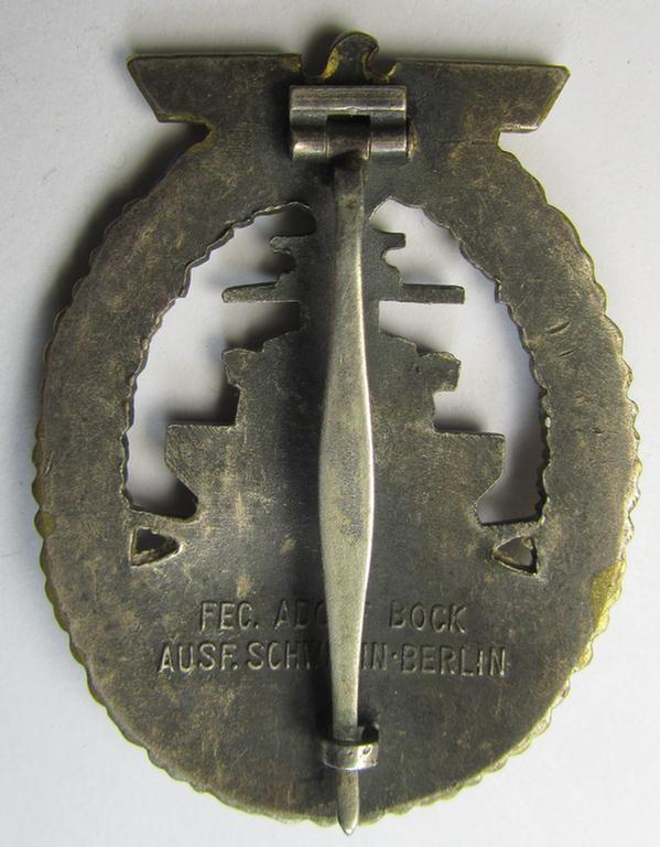 Stunning, WH (KM) 'Flottenkriegsabzeichen' (or: high-sea fleet badge) being a typical: 'Buntmetall'- (ie. 'Tombak'-) based and/or (I deem) early-war-period specimen that is neatly maker- (ie. 'Fec. Adolf Bock') marked on its back