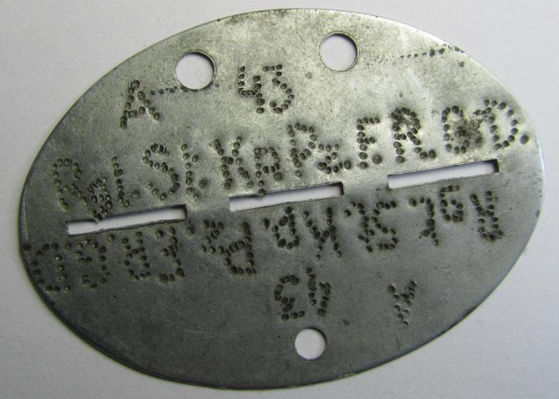 Attractive - and very ususal! - typical steel-based WH (Heeres) 'GrossDeutschland-Division'-related ID-disc bearing the (somewhat roughly- and privately done!) stamped unit-designation that reads: 'Rgt.St.Kp.Pz.F.R.G.D.'