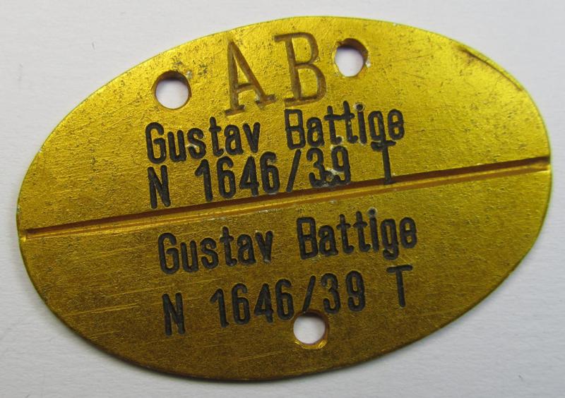 Unusual - I deem early-war-period- and/or: typical bright-golden-toned and aluminium-based - so-called: WH (Kriegsmarine) ID-disc bearing the stamped bearers'-name and/or function ie. unit-designation that simply reads: 'Gustav Battige - N 1646/39 T'