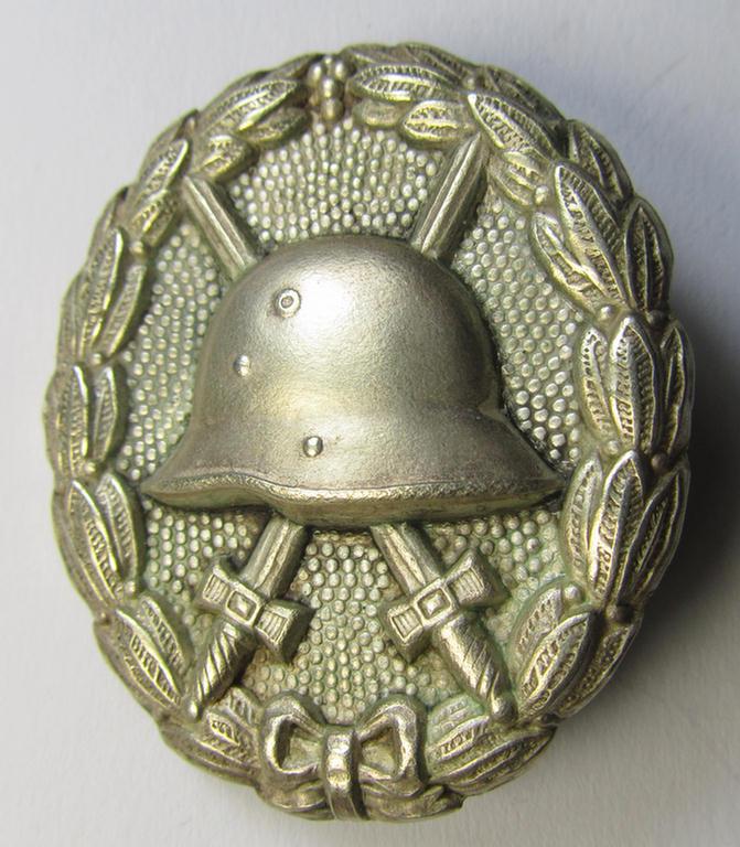 WWI-pattern, silver-class wound-badge (ie.: 'Verwundeten Abzeichen in Silber') being a detailed (and non-magnetic) example as executed in silvered 'Buntmetall' and that comes in a moderately used- ie. most certainly worn, condition