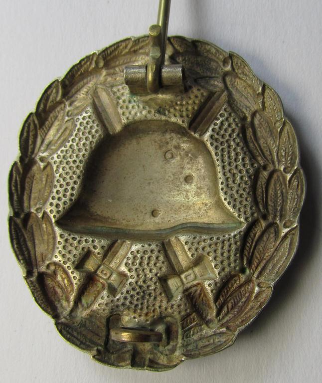 WWI-pattern, silver-class wound-badge (ie.: 'Verwundeten Abzeichen in Silber') being a detailed (and non-magnetic) example as executed in silvered 'Buntmetall' and that comes in a moderately used- ie. most certainly worn, condition