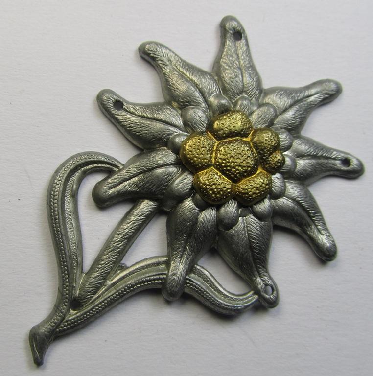 WH (Heeres) silver-greyish-coloured albeit non-maker-marked - so-called: M43-cap-badge (ie. 'Mützenabzeichen') depicting an: 'Edelweiss'-flower as was used by the various 'Gebirgsjäger'- (ie. mountain-troops-) related divisional-staff