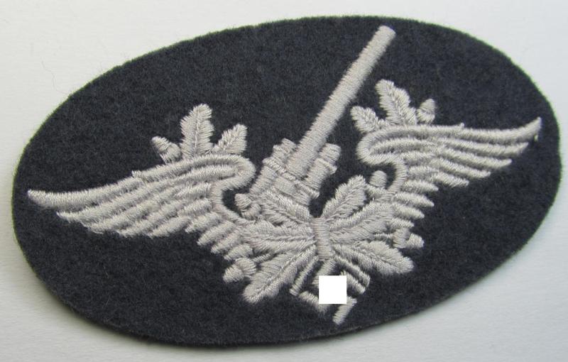Attractive, machine-embroidered WH (Luftwaffe) trade- ie. special-career-patch as was intended for: 'Flak-Artillerie'-staffmembers and that comes in a probably issued but never worn- (ie. 'virtually mint'-), condition