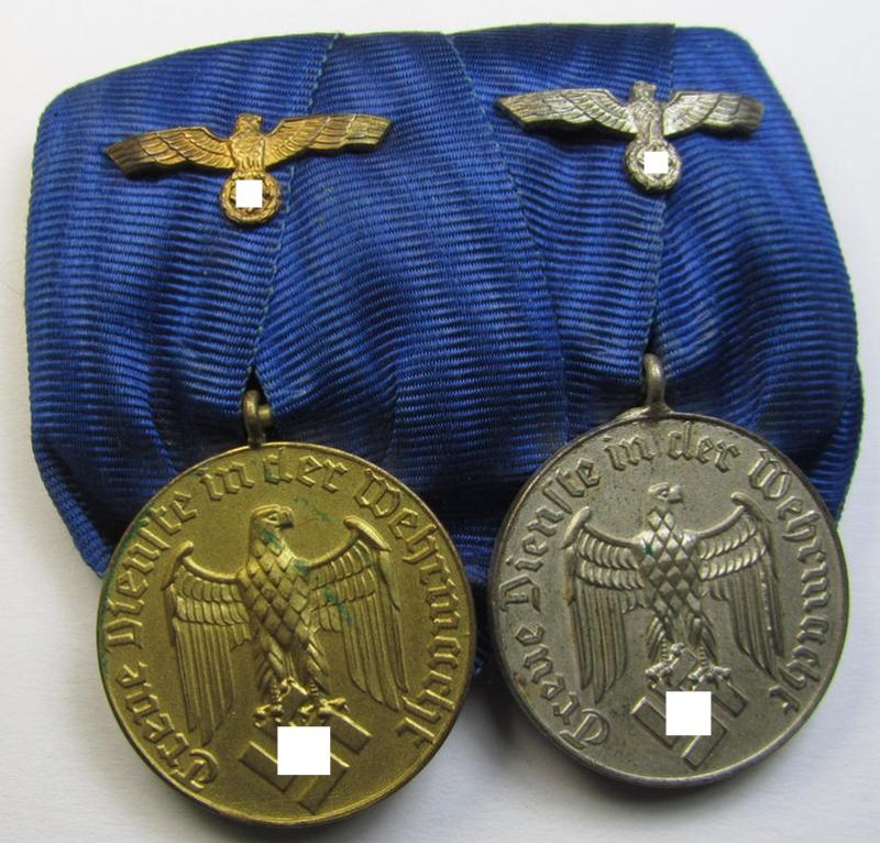 Attractive, two-pieced medal-bar (ie. 'Spange') showing two: WH (Heeres or Kriegsmarine) so-called: 'Dienstauszeichnungen für 4 u. 12 Jahre Treue Dienste' that both come period-mounted as a so-called: 'Doppelspange'